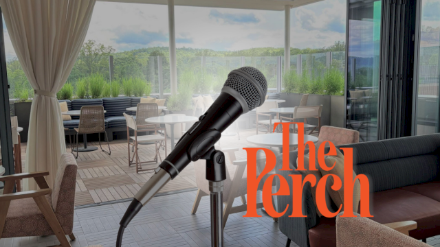 An outdoor patio with sofas and chairs, with a microphone overlay in the foreground suggesting an interview.