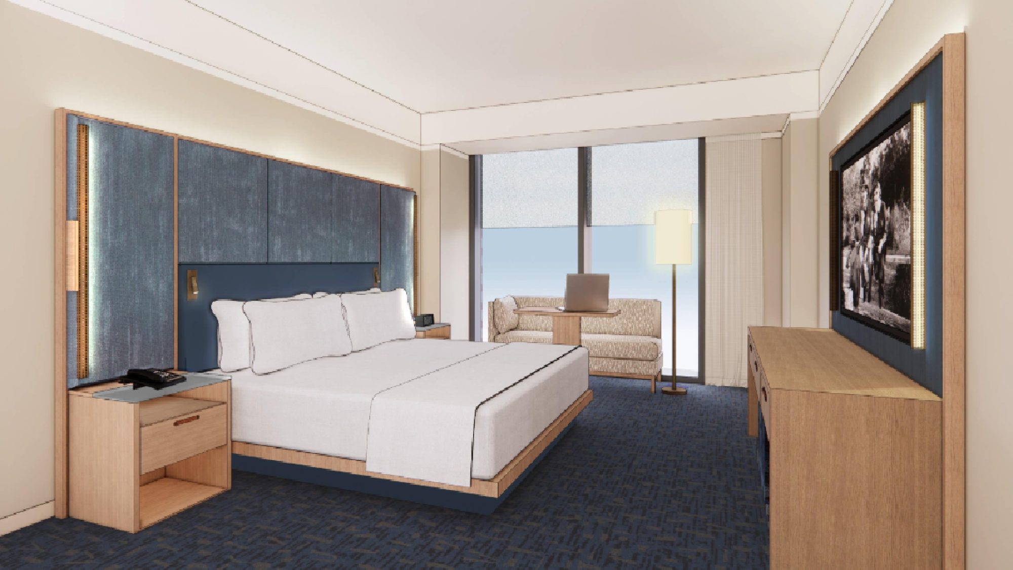 A modern hotel room with a large bed, nightstands, a sofa, a desk, and a TV on the wall, with floor-to-ceiling windows.