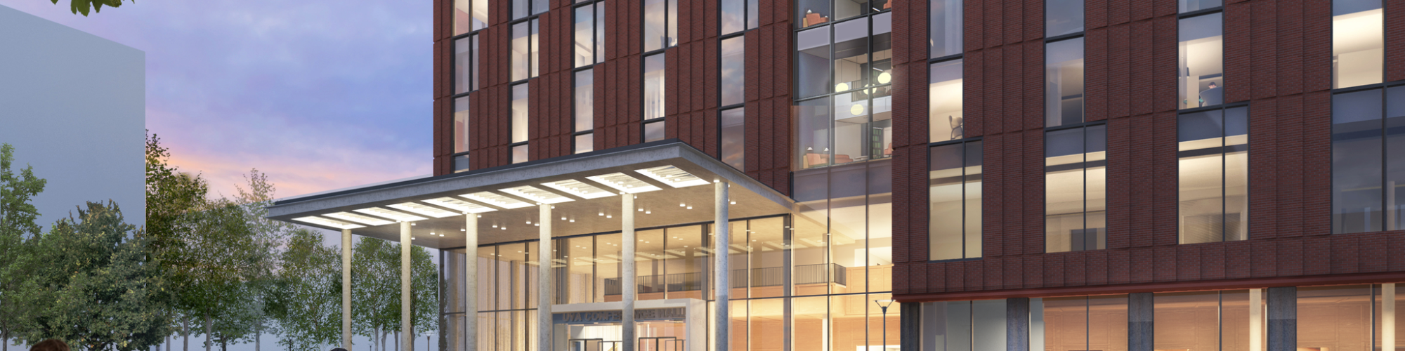 A modern glass-and-brick campus building with a welcoming entrance, people walking and gathering outside on a sunny day.