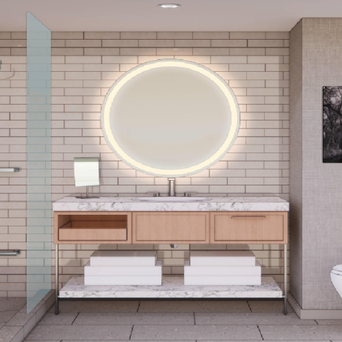 A modern bathroom with a glass shower wall, brick tile walls, circular backlit mirror, wooden vanity, stacked towels, and a toilet, all in neutral tones.